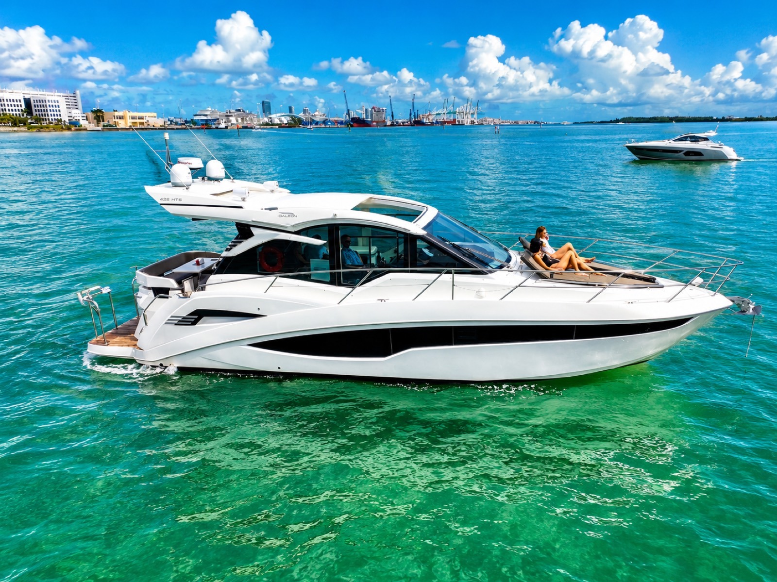 Galeon 45 "Kira" anchored in clear turquoise water off Miami, ready for a bachelorette party