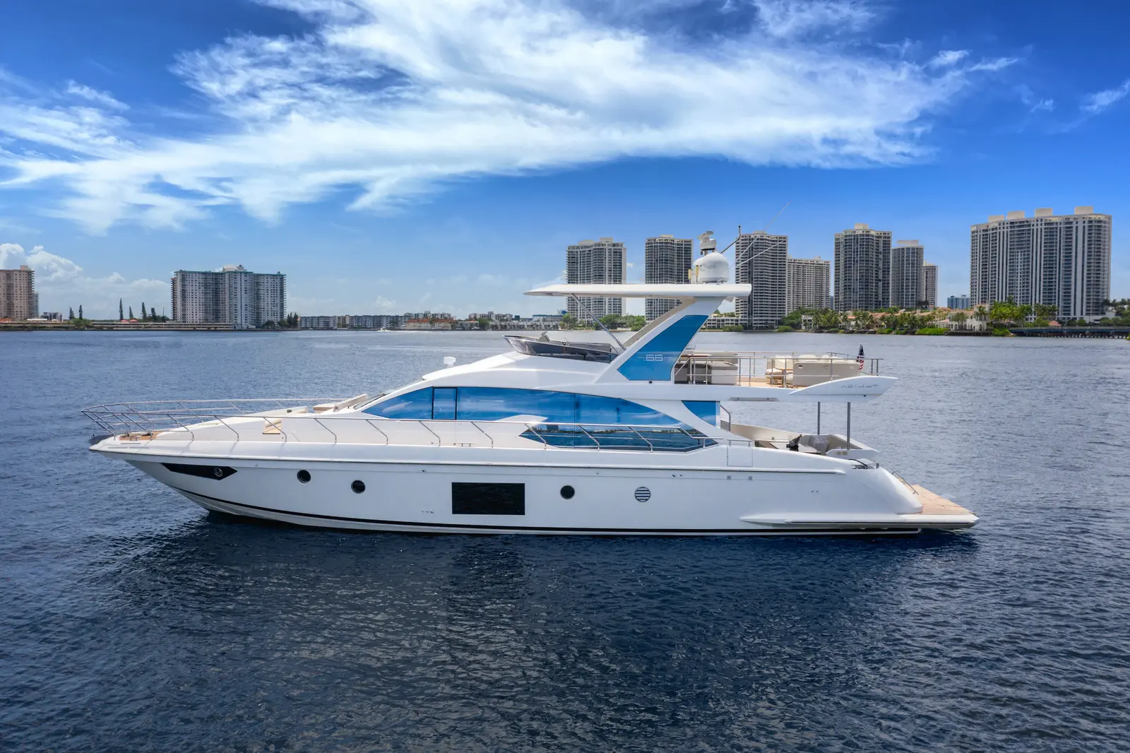 Azimut 68 "Le Grand Bleu" side profile on Biscayne Bay with the Sunny Isles skyline behind