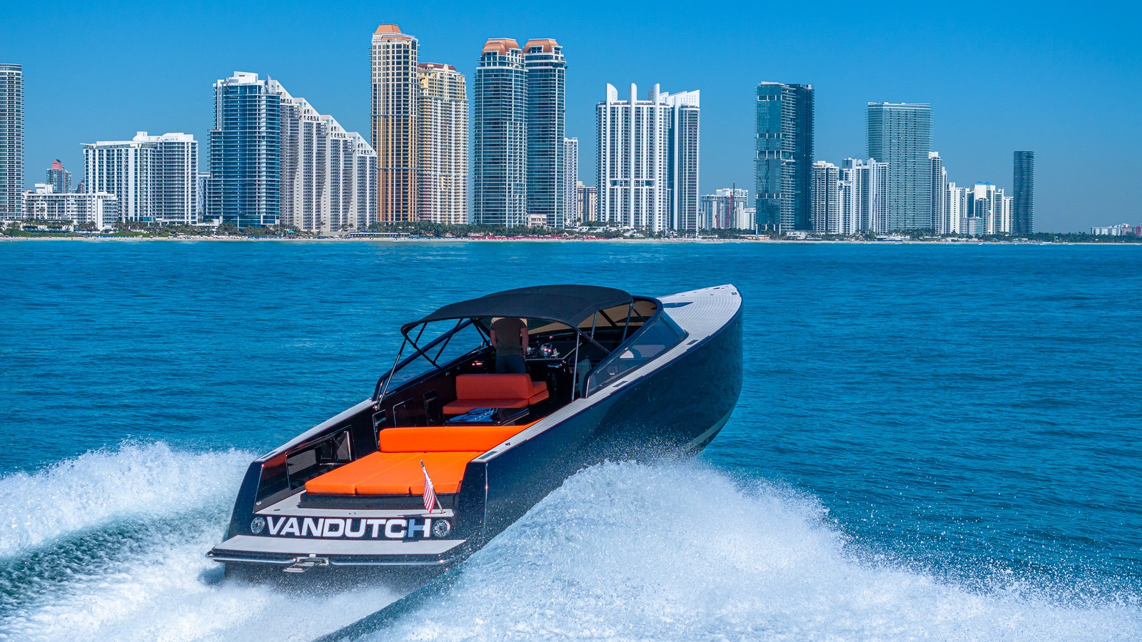 VanDutch 40 day boat with captain speeding past the Miami skyline
