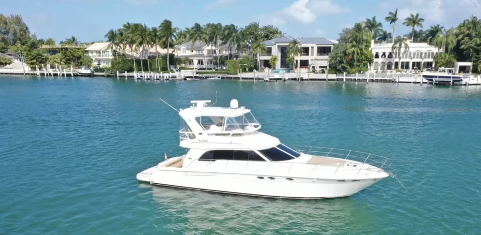 Sea Ray 52 flybridge yacht near waterfront homes in Miami