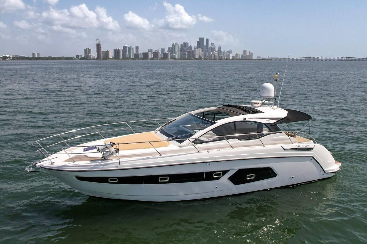 Azimut Atlantis 45 day yacht at anchor with the Miami skyline behind