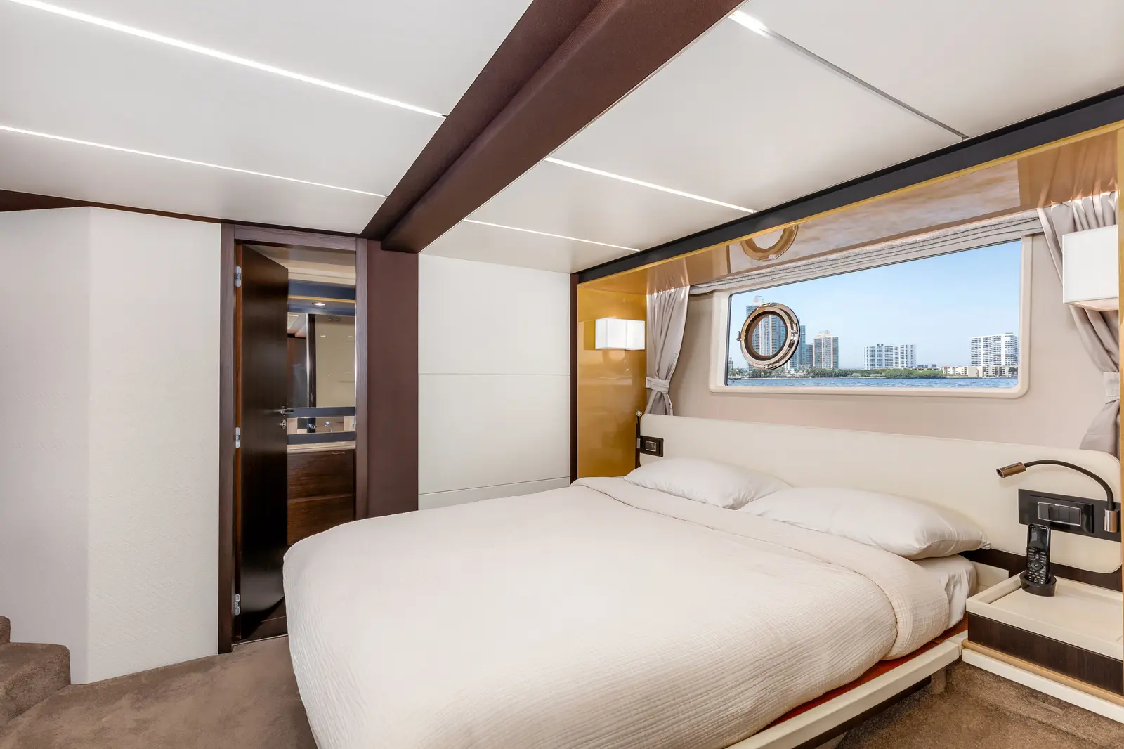 Azimut 68 "Le Grand Bleu" VIP cabin with a double bed and portholes