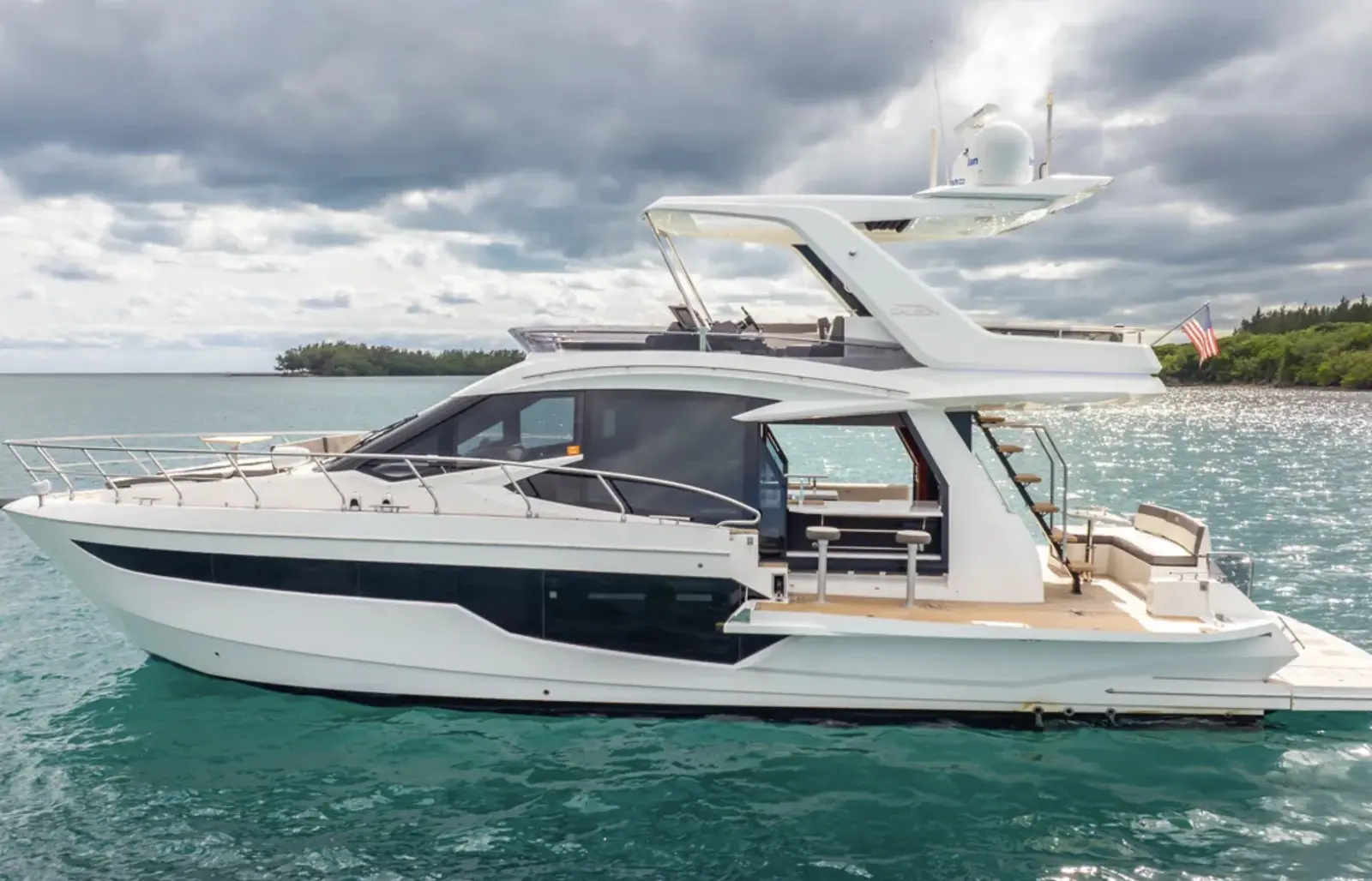 Galeon 53 flybridge yacht at anchor, side view