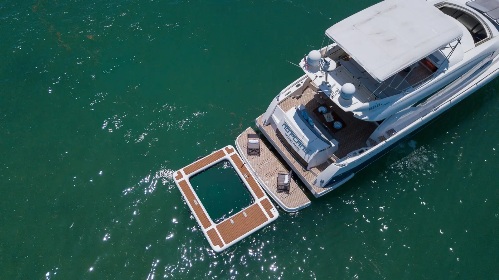 Prestige 65 "No Plans" stern with the floating pool, from above