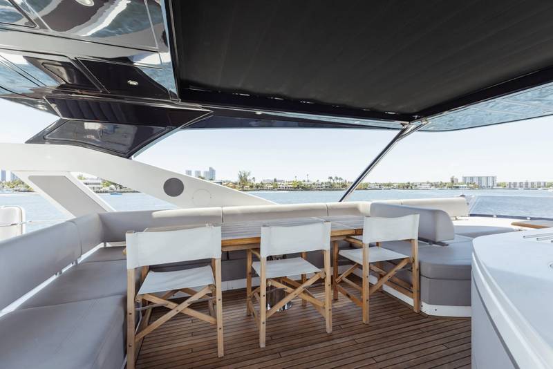 Sunseeker 80 flybridge dining under the hardtop