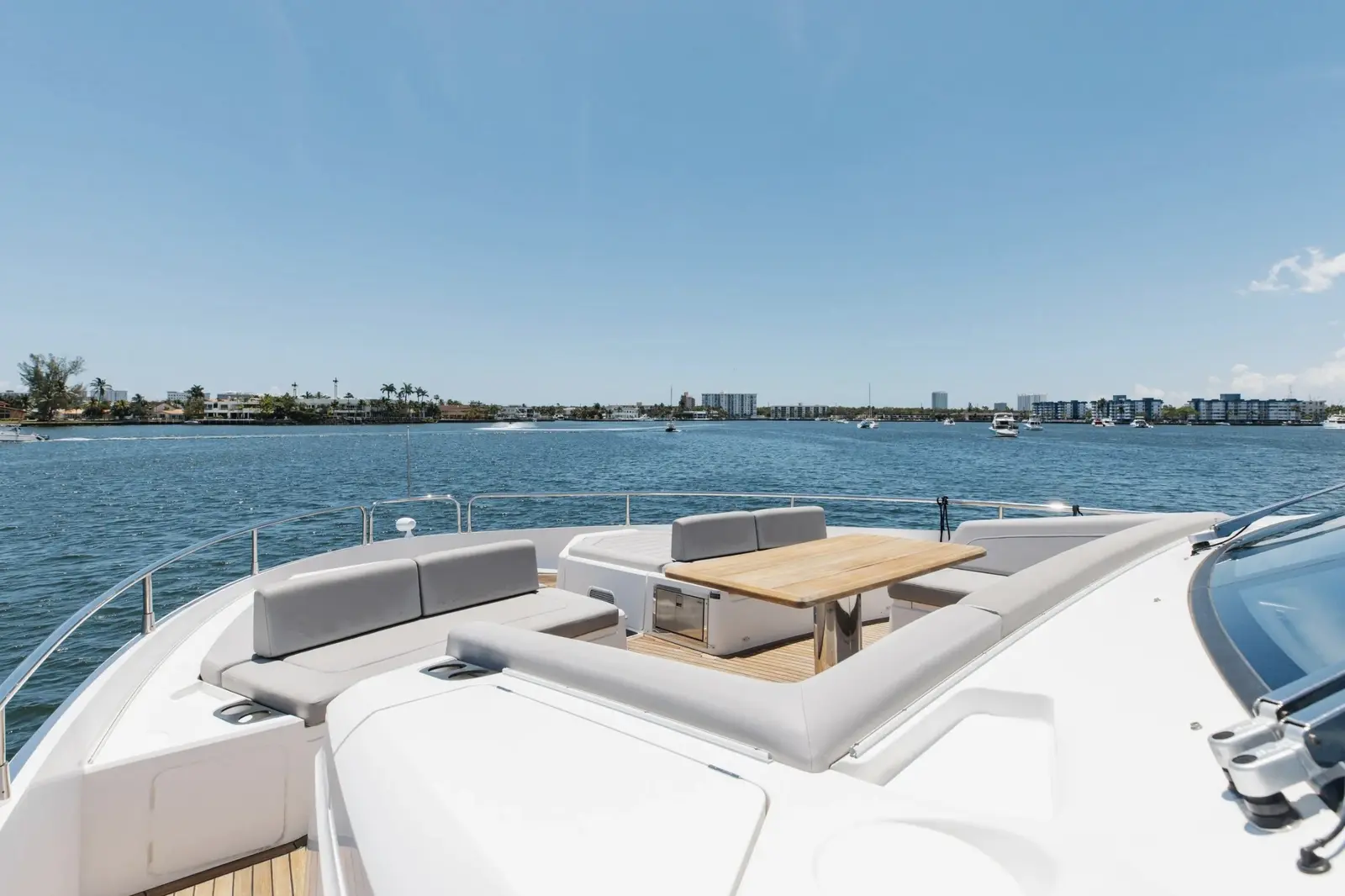Sunseeker 80 flybridge lounge with the bay behind