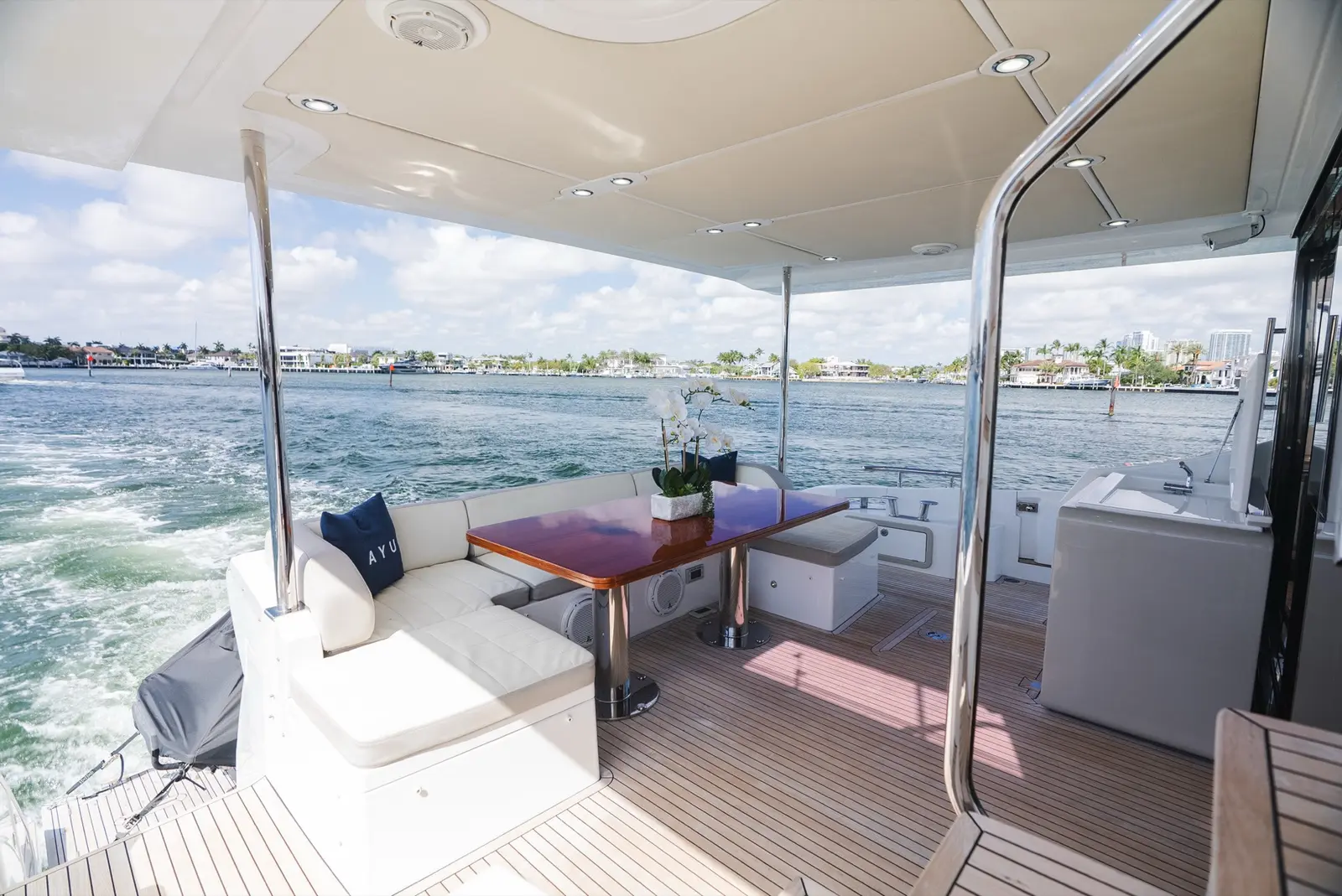 Azimut 75 aft deck lounge with the bay behind