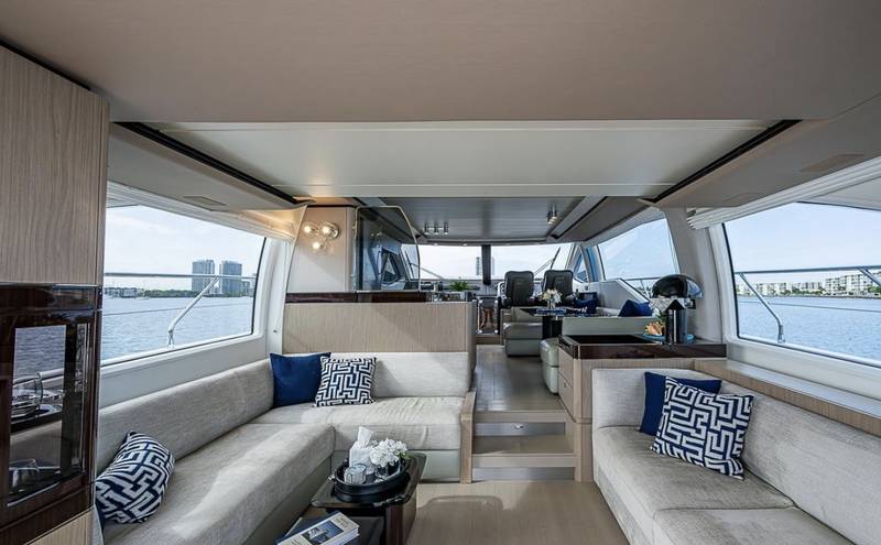 Azimut 70 "ALEV" salon with white sofas and blue cushions