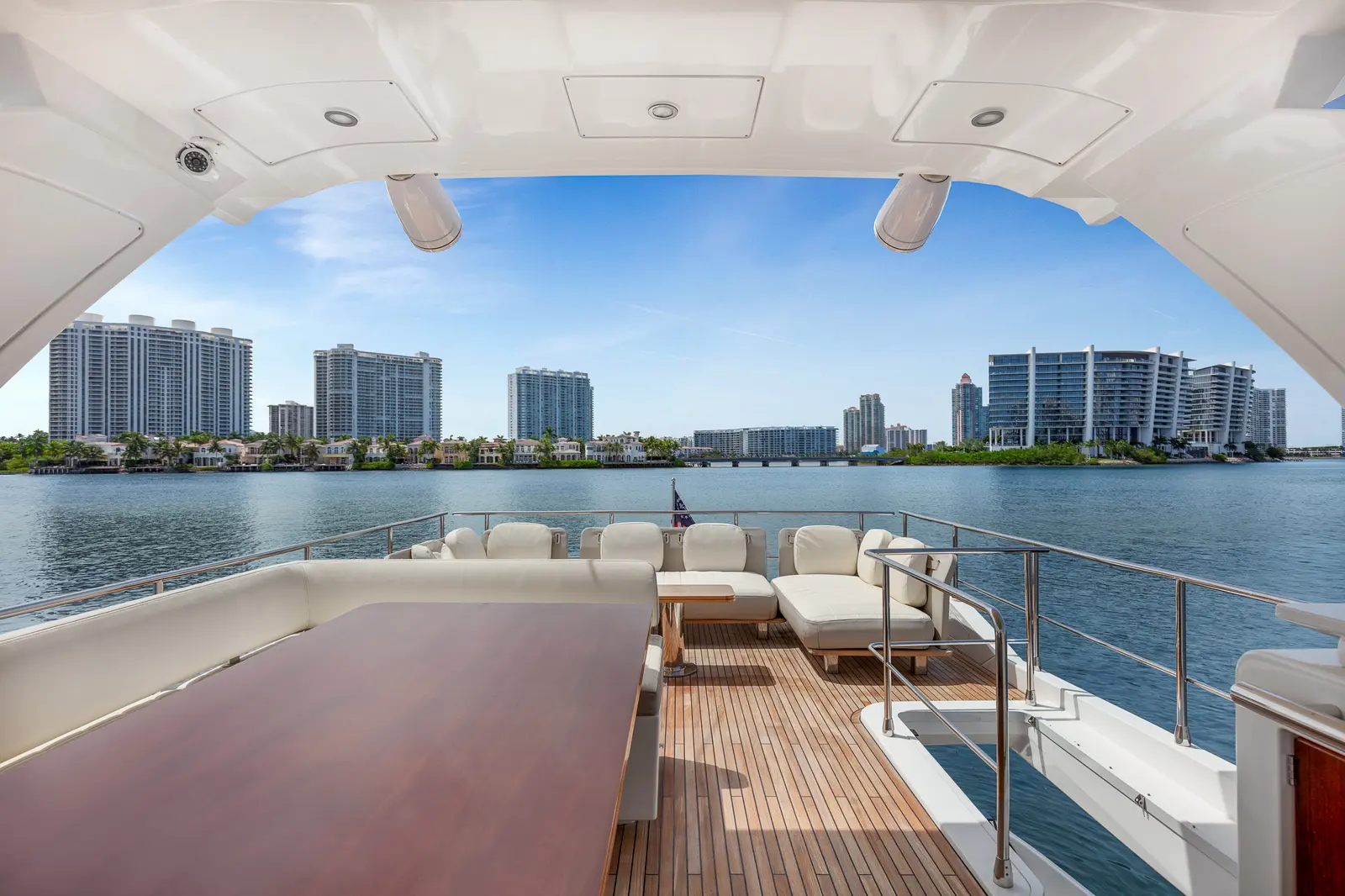 Azimut 68 "Le Grand Bleu" aft deck with teak floor and dining table