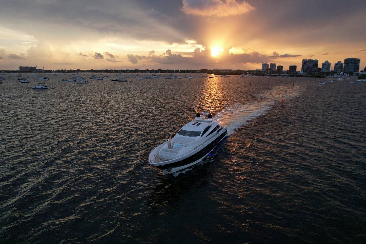 Sunseeker 108 cruising toward the setting sun, seen from above