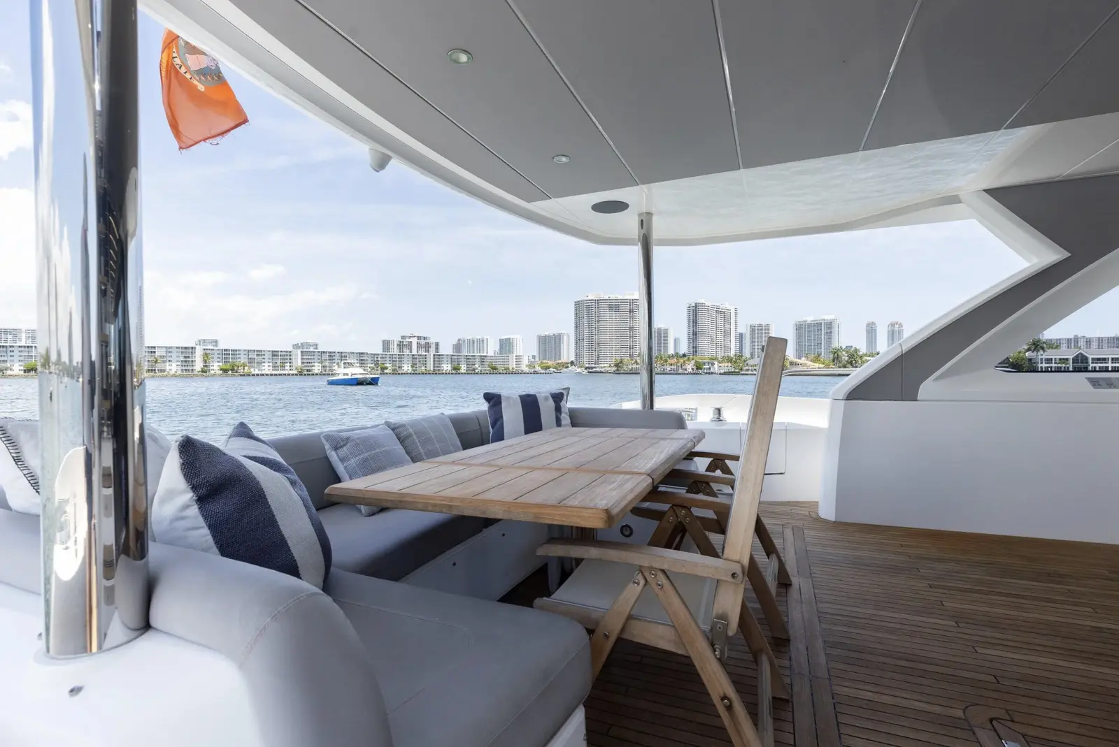 Sunseeker 80 aft deck dining with the skyline