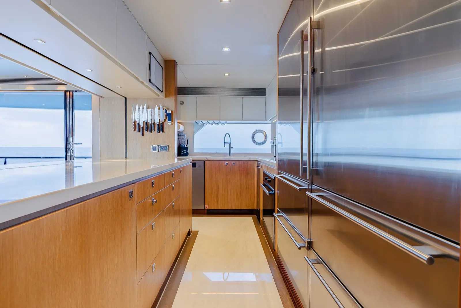 Horizon FD90 Skylounge galley with stainless fridge