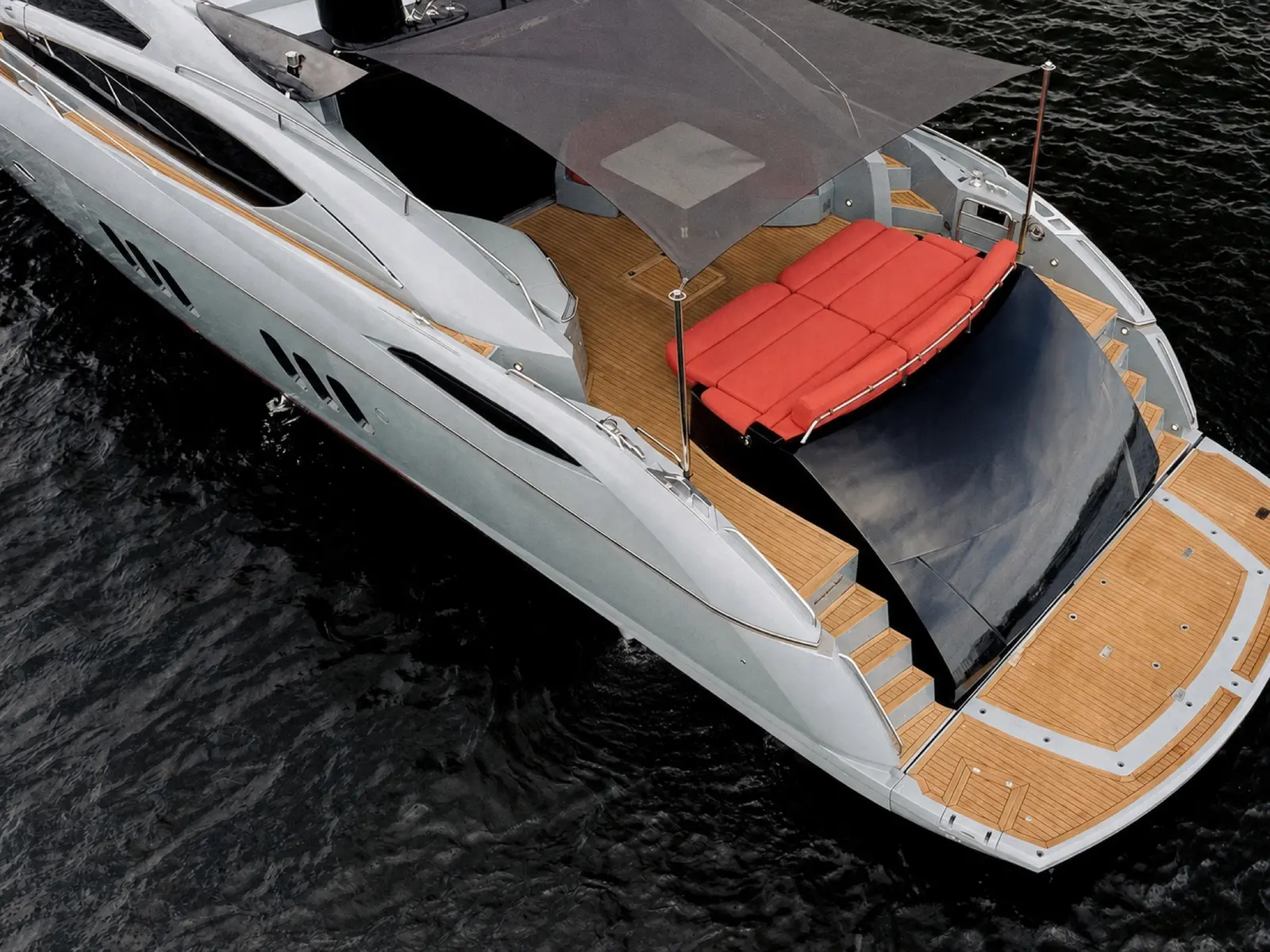 Sunseeker 85 aft deck with red sun pad, from above
