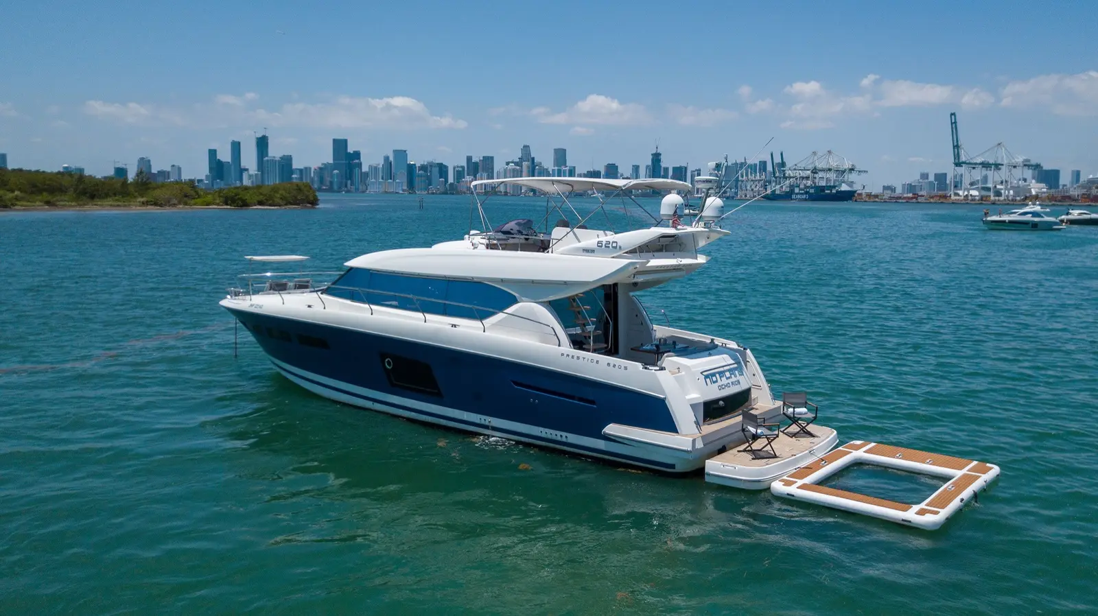Prestige 65 "No Plans" with the Miami skyline behind