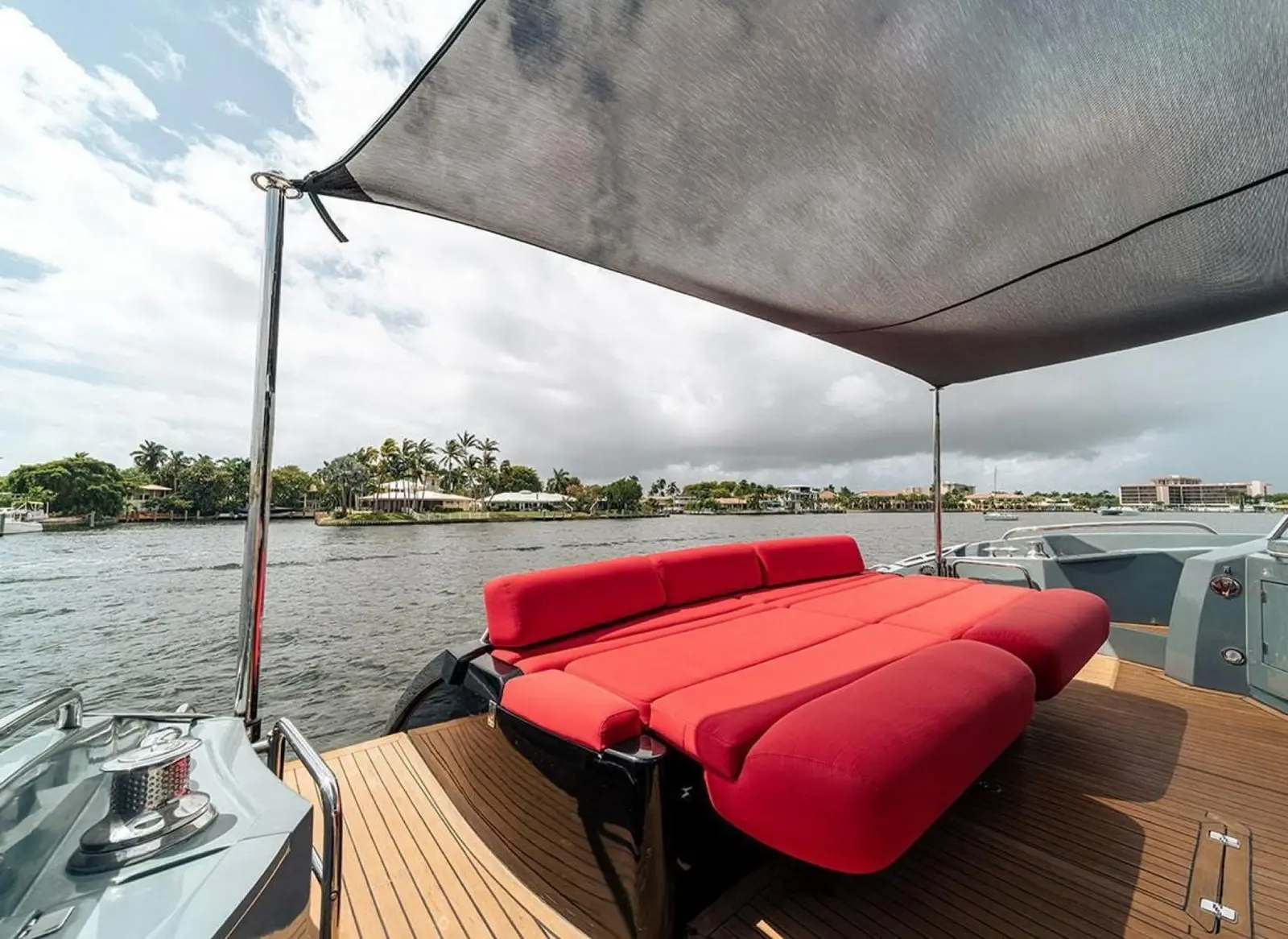 Sunseeker 85 aft deck lounge with red cushions